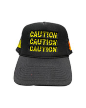 Load image into Gallery viewer, ”CAUTION” ⚠️ BLACK TRUCKER HAT
